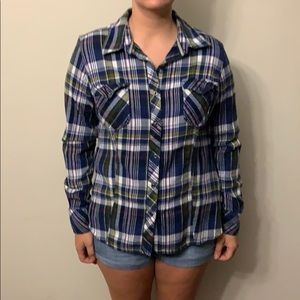 Plaid button up shirt.